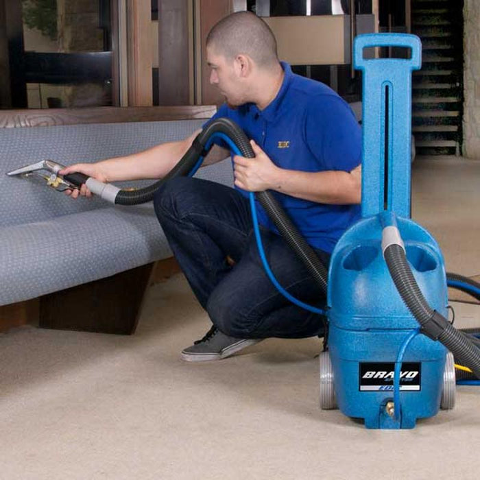EDIC Bravo Carpet Spotter and Upholstery Cleaner action view cleaning sofa.