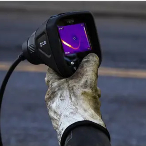 Teledyne FLIR VS290 32 closeup gloved hand holding thermal display with screen on.