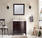 Bathroom with a dark wooden vanity, marble countertop, square mirror, and two sconces, plus a chair with towels, baskets, and a white ladder shelf.