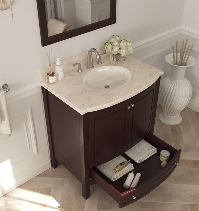 Close-up of a bathroom vanity in dark wood with a light stone countertop, featuring a sink, a decorative flower vase, and an open drawer filled with folded towels and toiletries.