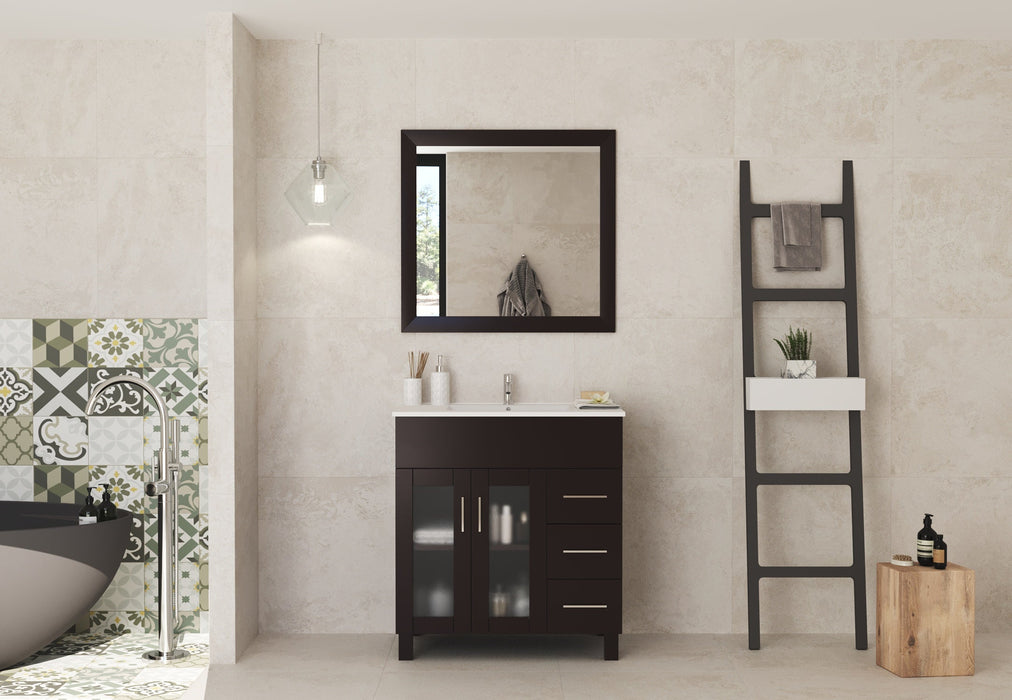 Bathroom vanity with a dark brown cabinet and white countertop, a square mirror above it, and a decorative ladder with a plant and towels on the side.
