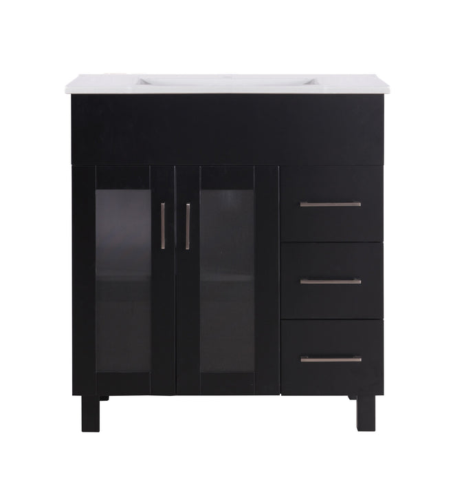 Black vanity with white countertop, featuring two glass-paneled doors and three drawers with silver pulls.
