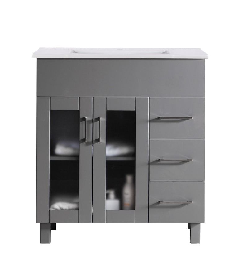 Gray bathroom vanity with white countertop and silver handles.