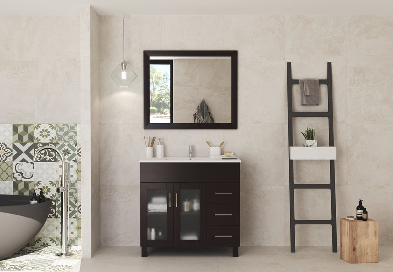 Bathroom with dark wood vanity, matching mirror, and decorative ladder.