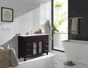 Bathroom with a dark wood vanity, white tiles, and a white freestanding tub.