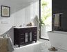 Bathroom with a dark wood vanity, white tiles, and a white freestanding tub.