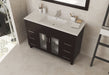 Bathroom vanity with dark cabinet, light countertop, and sink.