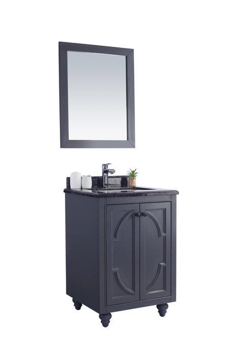 Bathroom vanity with a dark gray cabinet, black marble countertop, and matching framed mirror.