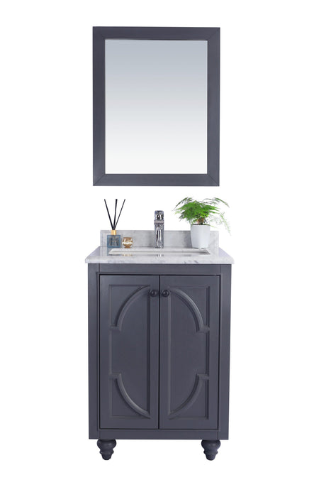 Gray vanity with marble countertop and mirror.