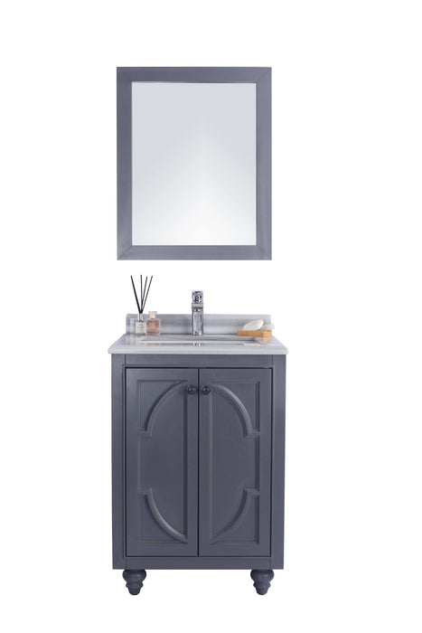 Gray vanity with mirror, marble countertop, and decor.