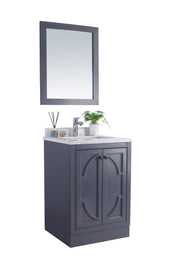 Gray vanity with marble top and framed mirror.
