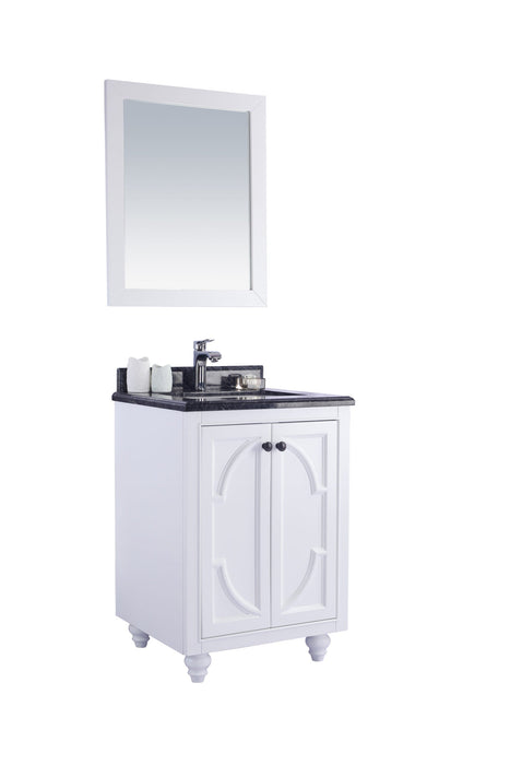 White bathroom vanity with black granite countertop and matching mirror.
