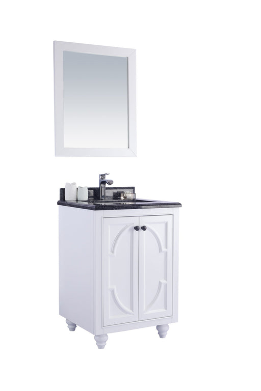White bathroom vanity with black granite countertop and matching mirror.

