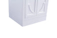 White cabinet with paneled doors.