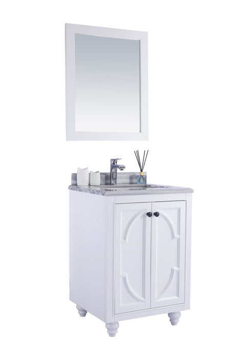 White vanity with marble top and matching mirror.