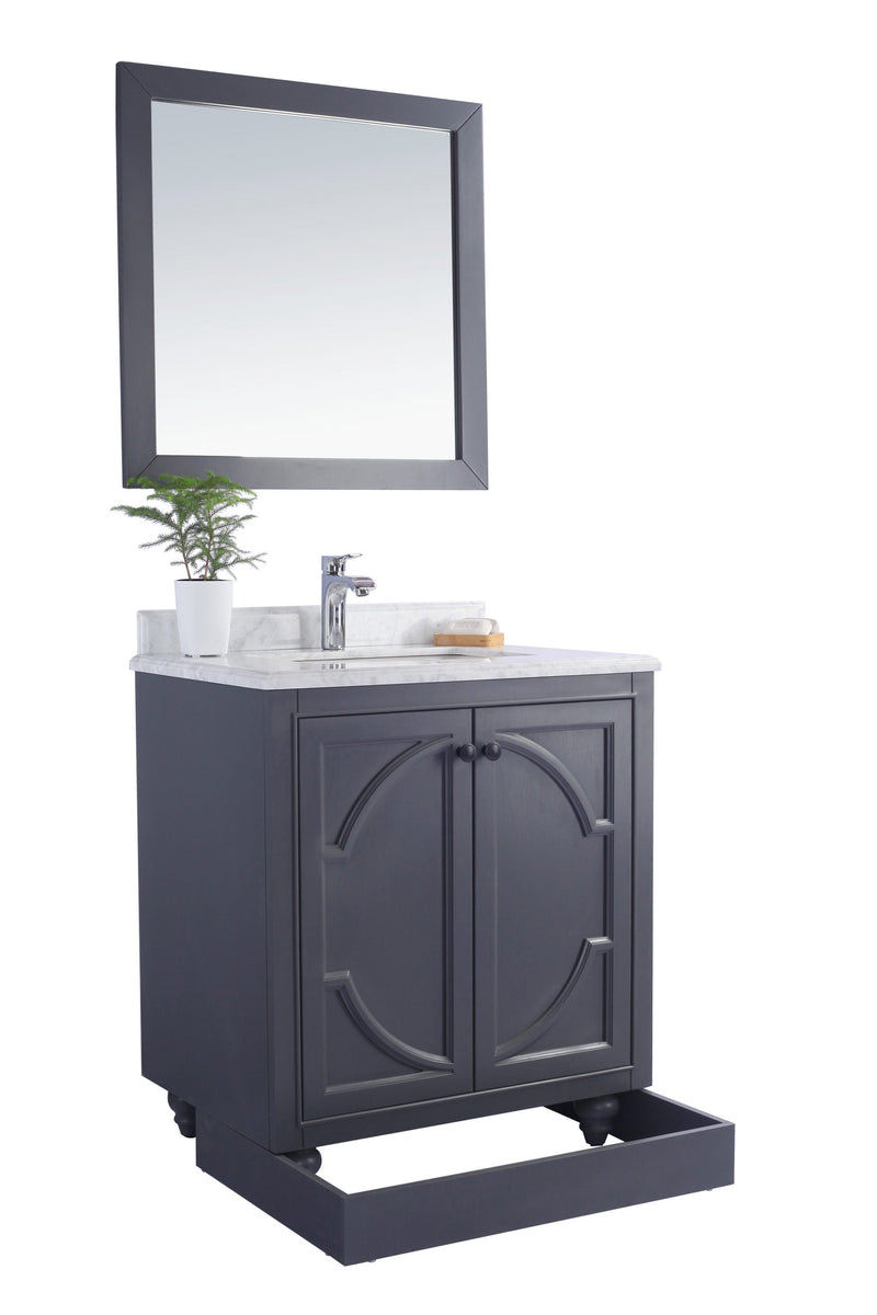 Gray vanity with white marble top and square mirror.