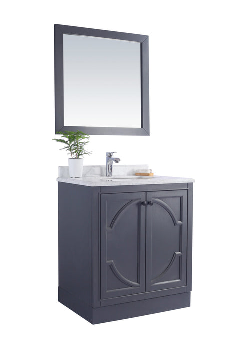Bathroom vanity with mirror and marble countertop.