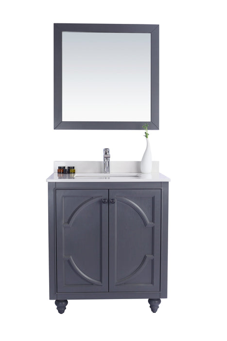 Gray bathroom vanity and mirror with white countertop.