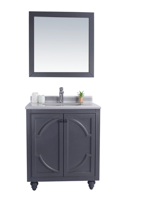 Gray bathroom vanity with marble countertop and matching mirror.