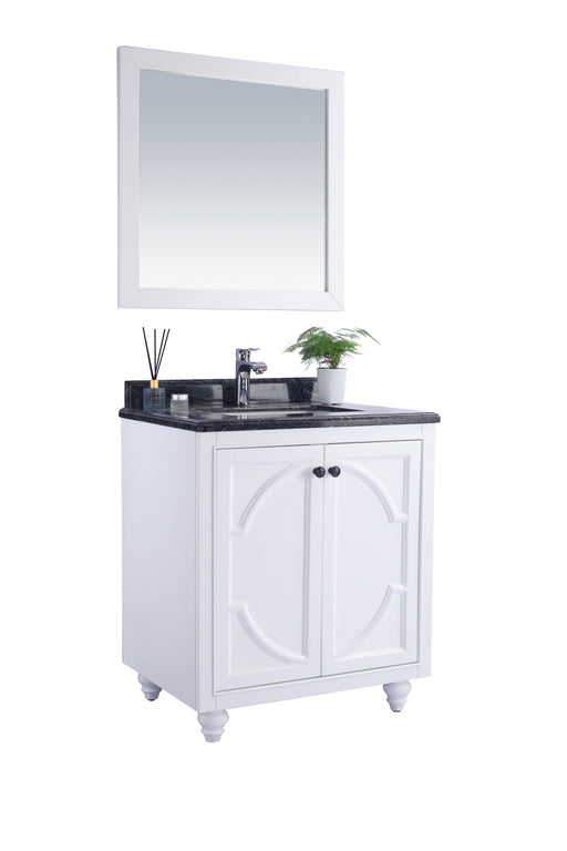 White bathroom vanity with a black countertop and a framed square mirror above.