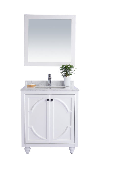 White bathroom vanity with mirror and marble countertop.