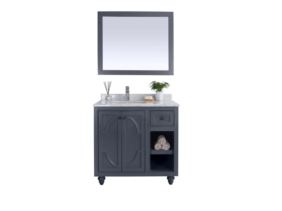 Gray vanity and mirror set with marble countertop.
