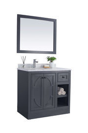Bathroom vanity with gray cabinets, marble countertop, and rectangular mirror.