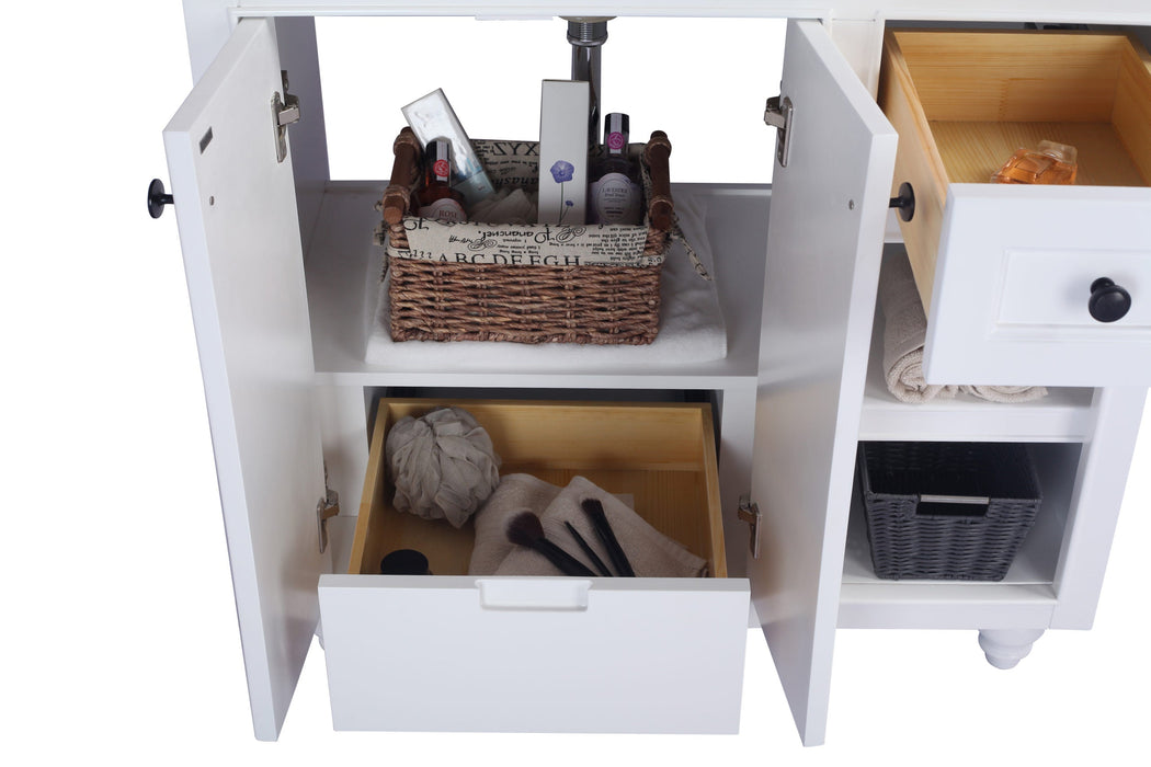 Open white vanity with toiletries and drawers.
