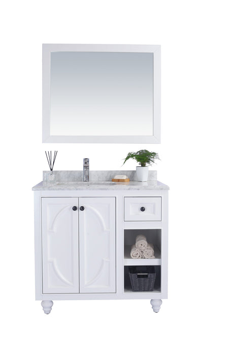 White bathroom vanity with marble top and matching mirror.
