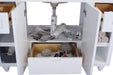 White bathroom vanity cabinet with open doors and drawers revealing various toiletries, towels, and cosmetics.