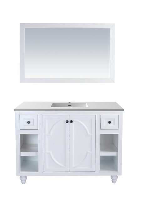 White bathroom vanity with mirror.
