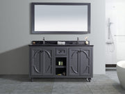Bathroom vanity with gray cabinet, dark countertop, and matching mirror.