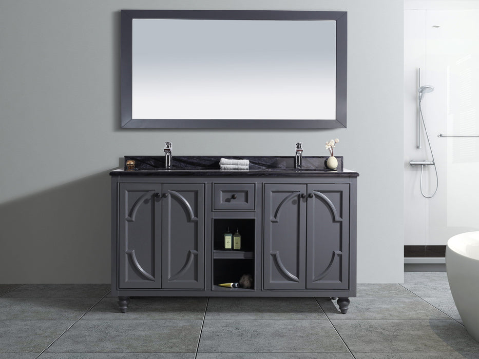 Bathroom vanity with gray cabinet, dark countertop, and matching mirror.