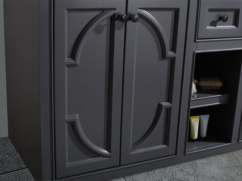 Gray bathroom vanity with doors, open shelving, and drawer.