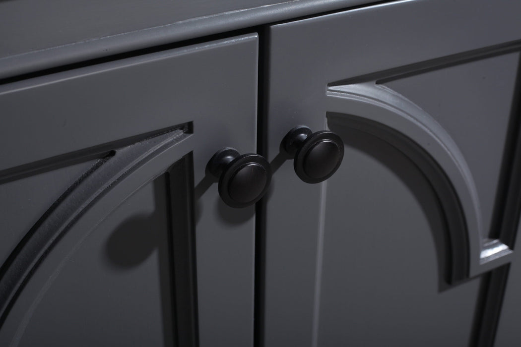 Close-up of gray cabinet doors with black knobs.