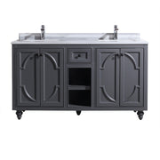 Bathroom vanity with marble top, two sinks, gray cabinets, decorative doors, and shelves.