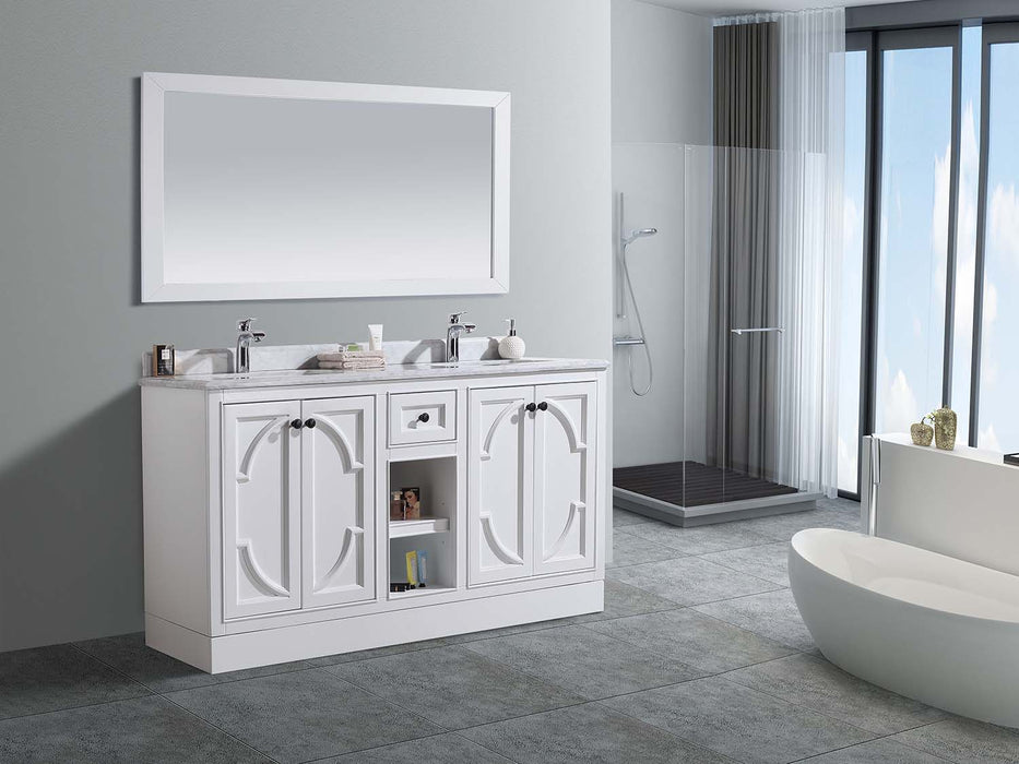 Bathroom with white double vanity, marble countertop, rectangular mirror, and freestanding bathtub.
