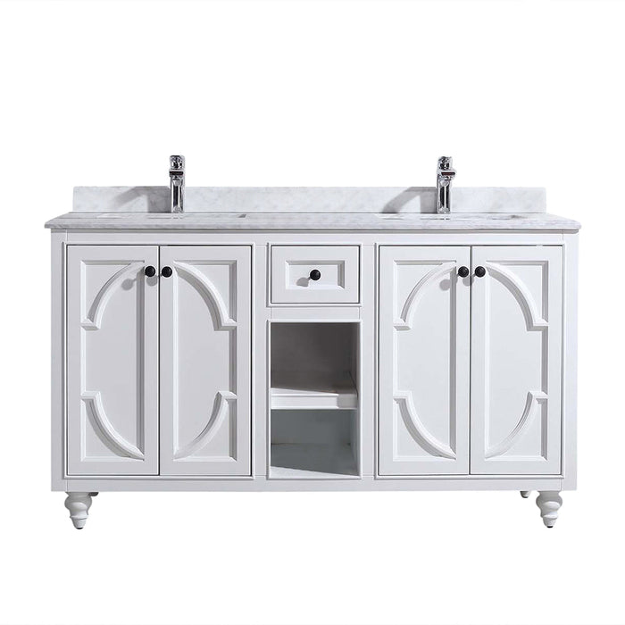 White double vanity with marble countertop and two faucets.
