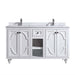 White double vanity with marble countertop and two faucets.
