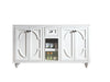 White bathroom vanity with dark knobs and decorative molding.