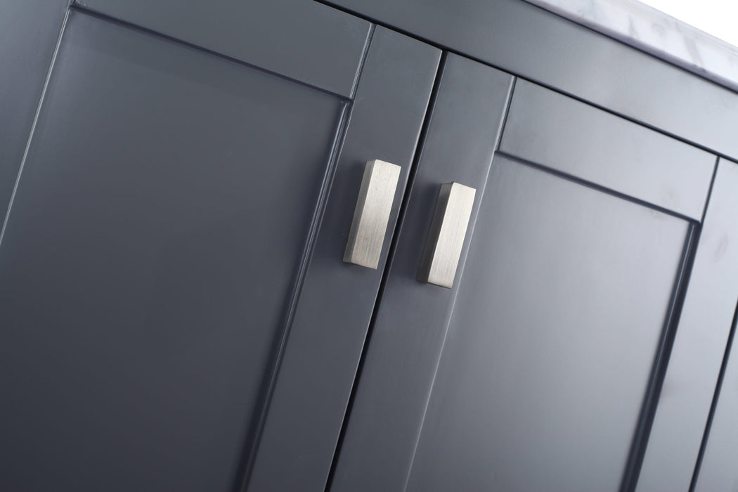 Close-up of gray cabinet doors with silver handles.