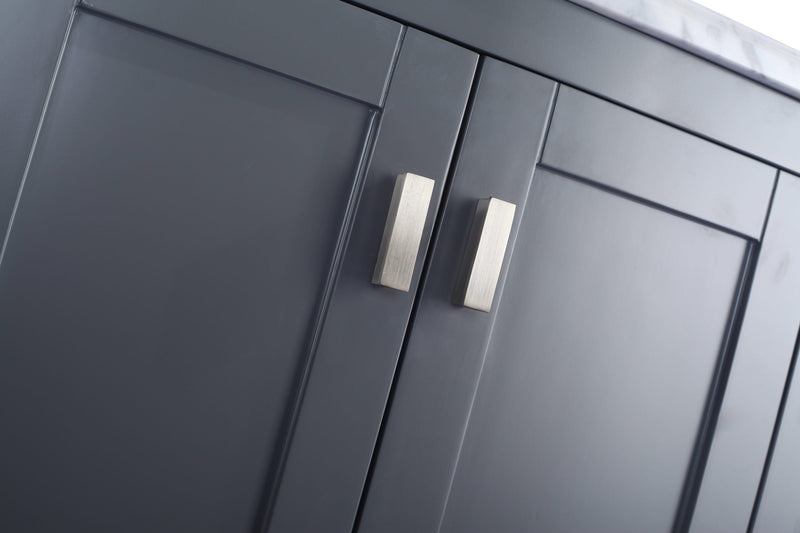 Close-up of gray cabinet doors with silver handles.