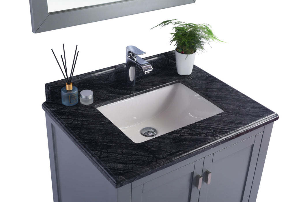 Gray vanity with black marble countertop and white sink.