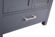 Gray vanity with a drawer and a silver handle.