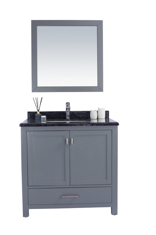 Gray bathroom vanity with black countertop and matching mirror.