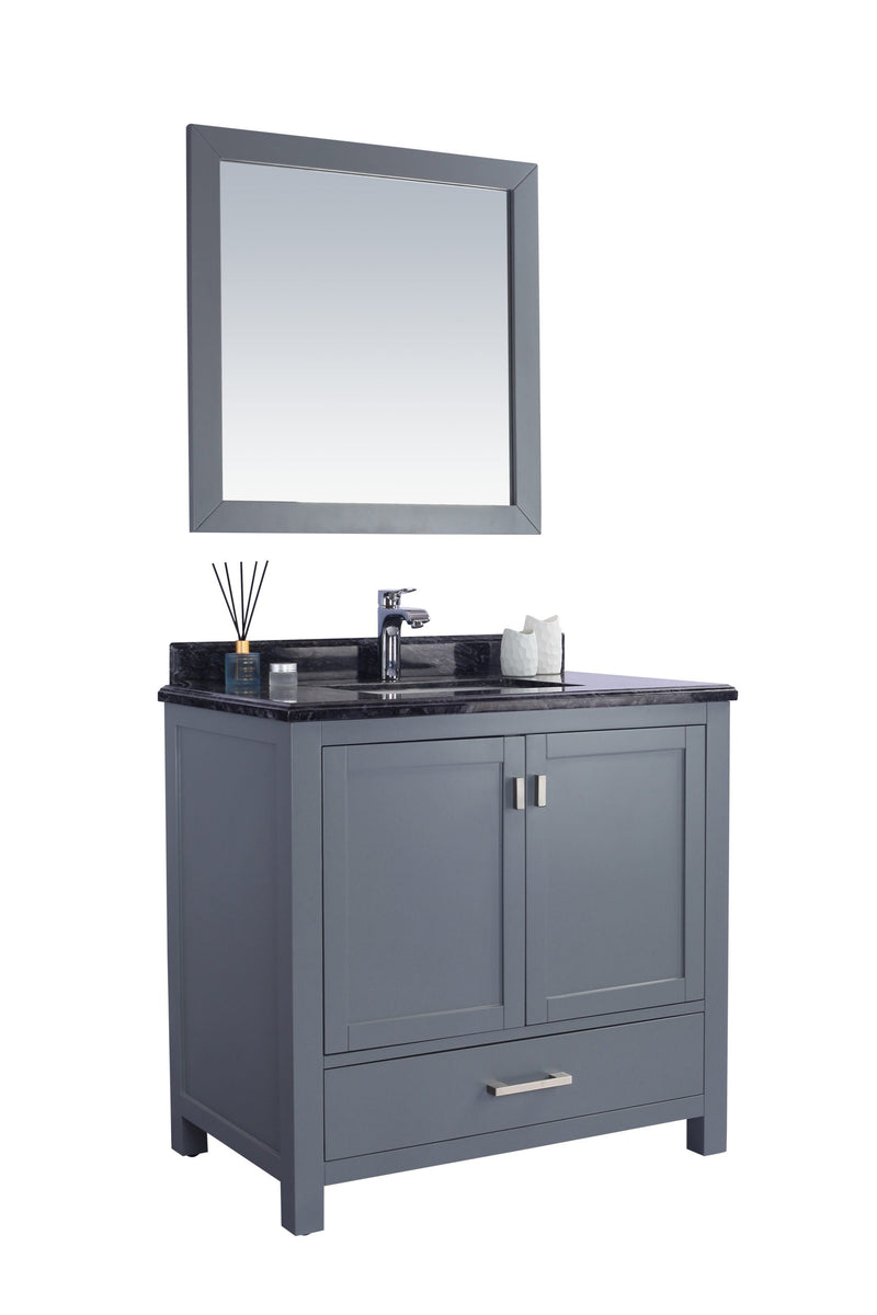 Gray bathroom vanity with mirror, black marble top, and silver fixtures.