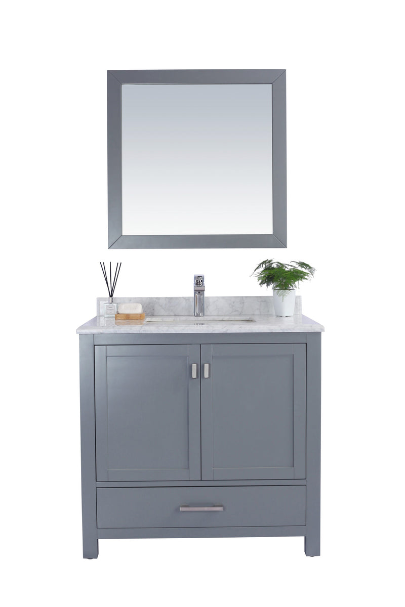 Bathroom vanity with gray cabinet and square mirror.
