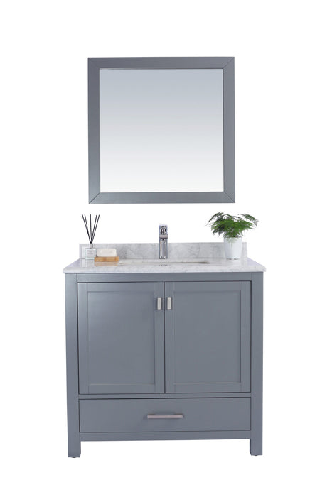 Bathroom vanity with gray cabinet and square mirror.
