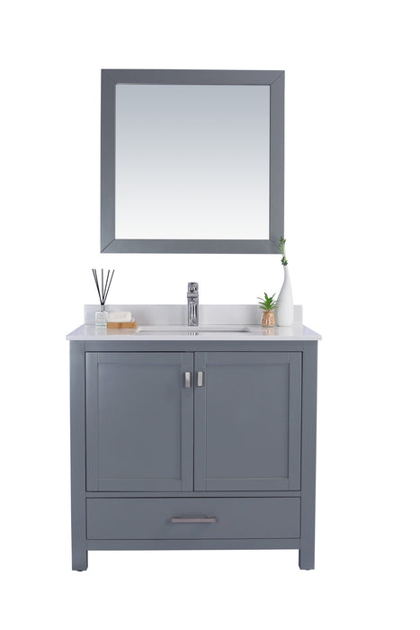 Bathroom vanity with grey cabinet, white countertop, chrome faucet, and square mirror.
