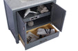Gray bathroom vanity with white marble top, open cabinet, and partially open drawer.